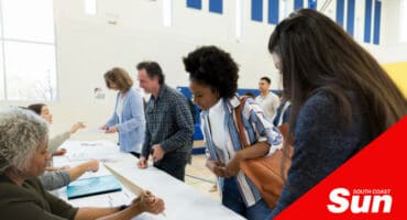 people voting at a voting station