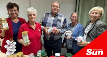 a group photograph with jars of food