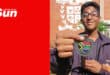 a sports learner at a school shows off his martial arts medal