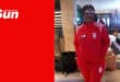 a portrait of a woman wearing a tracksuit