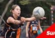 a netball player passes the ball