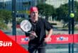 a person with a bandana playing padel
