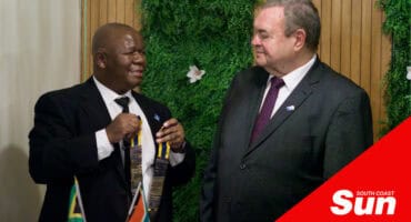 an organisation's former president handing over the chain of command to another member