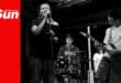 a teenage rock band performing on a small stage