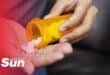 a pill bottle being emptied into someone's hands