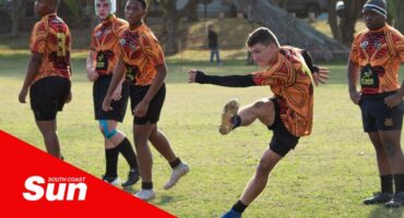 a rugby player doing a free kick