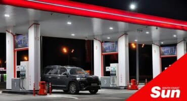 a van at a petrol station in the night