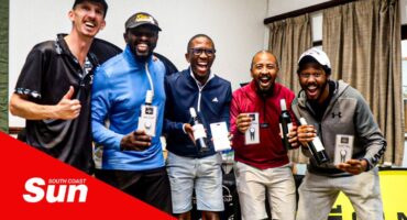 a group celebration photograph where people are showing off their prizes