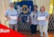 a service club welcomed two new members to the club, with commemorative certificates