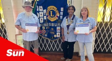 a service club welcomed two new members to the club, with commemorative certificates