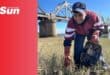 a high school learner cleans up a beach with a rubbish bag