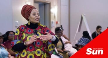 a woman talking at a peace dialogue conference