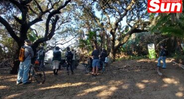 a group of people in nature conducting an anti-poaching day