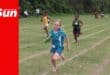 a track runner schoolchild competes in the relay race