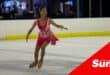 an ice skater figure skating in the rink