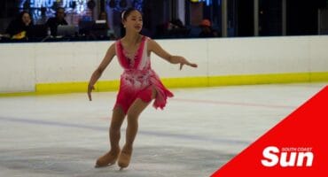 an ice skater figure skating in the rink