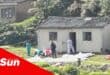 bodies covered up, police and forensic pathology service outside a home process a crime scene
