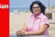a woman's portrait on a beach bench