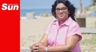 a woman's portrait on a beach bench