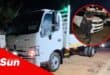 a truck. inset is a security officer with an assault rifle