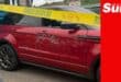 an suv behind police tape, the car has dozens of bullet holes in the driver-side door.