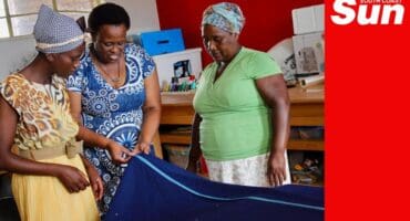 three woman with a sewn dress