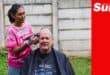 a woman shaving a man's head for a cancer shavathon