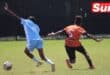 A Toti United player tries to maintain pressure on the opposing team.