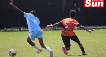 A Toti United player tries to maintain pressure on the opposing team.