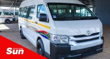 A toyota taxi in a taxi rank