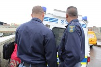 Officers lock away a resident of the squatter camp when large amounts of dagga was recovered.