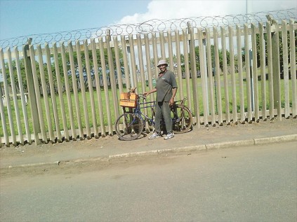 A dog is happily carted around by his owner on its way to receiveing its innoculations.