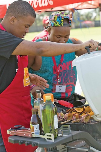 Team Braai Dukes, braai buddy Kevin Jonas and braai master Milan Motlohi in action.