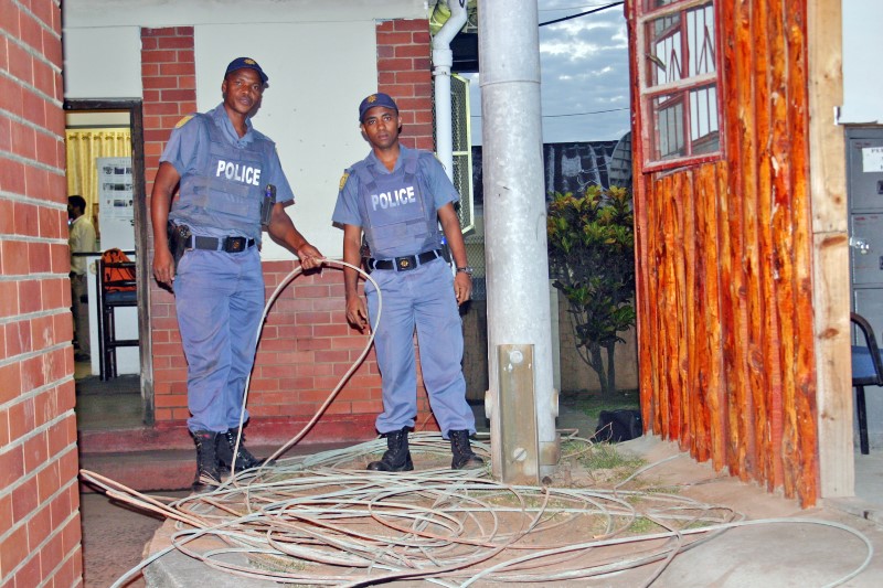 Warrant Officers, Alex Maphumulo and Herbert Ngcobo show the copper recovered from a botched robbery.