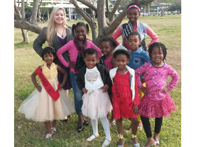 Beauty pageant hopefuls take some time out of their busy schedules to pose for a picture.