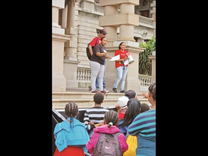 Youngsters gather outside city hall to voice their concerns.