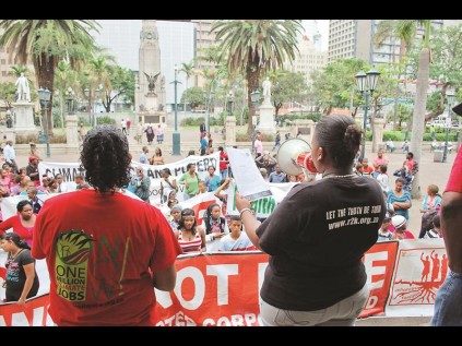 Youngsters gather outside city hall to voice their concerns.