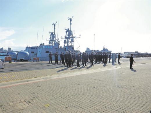 A parade is held as Lt Cdr Mabuse prepares to take command of the SAS Isaac Dyobha.