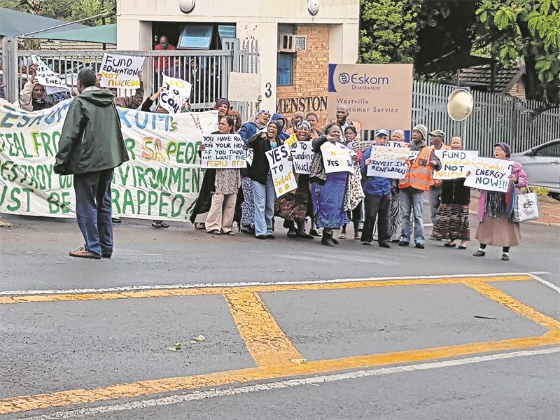 SDCEA and local residents protest outside the Eskom offices.