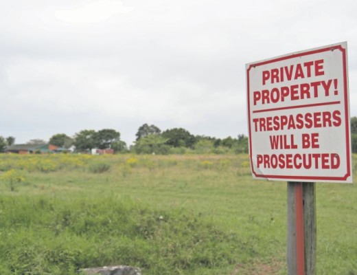 A private property sign is put up on what used to be a popular public area for dog walkers, joggers and sportsmen.