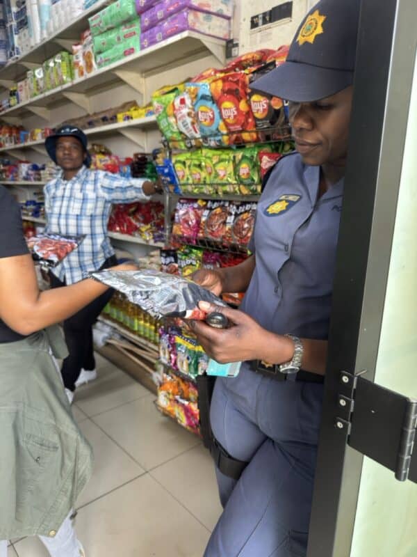 Montclair police station's Sergent Lettie Gasa checks the products labelling.