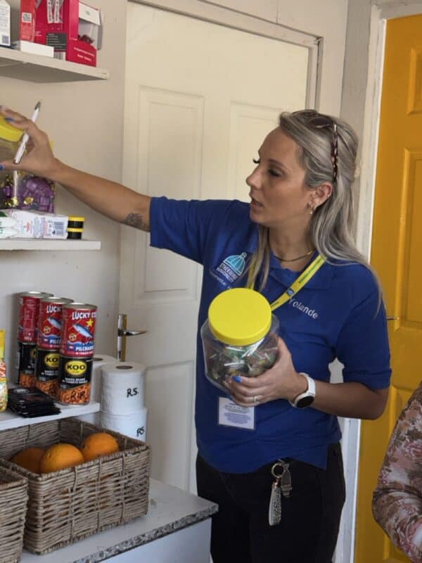 Yolande Botha checks the products of a tuck shop in ward 64