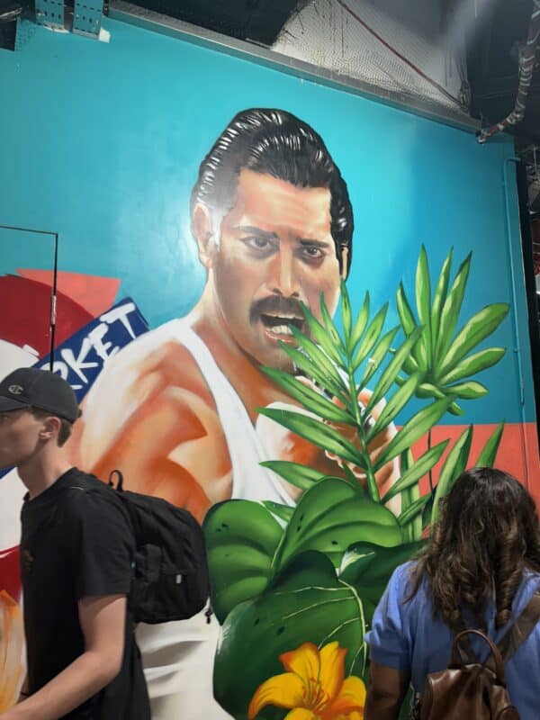 Mural of the late Freddie Mercury displayed along the market walls, a nod to the importance of music at the market.
