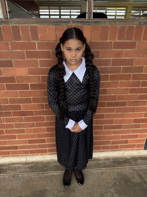 Jia Joubert impersonates Wednesday Addams.