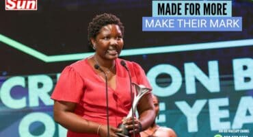 General manager for Made for More accepts the award.