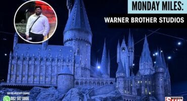 Dillon Pillay, journalist for the Southlands Sun, pictured with the Hogwarts Castle model.