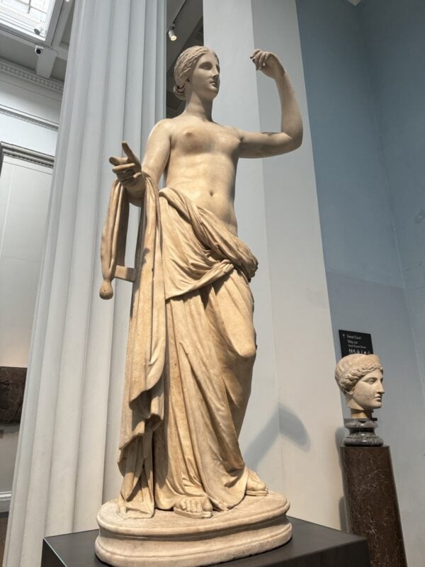 One of the greek statues that tower one of the exhibits.