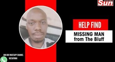 A bald African man with a beard