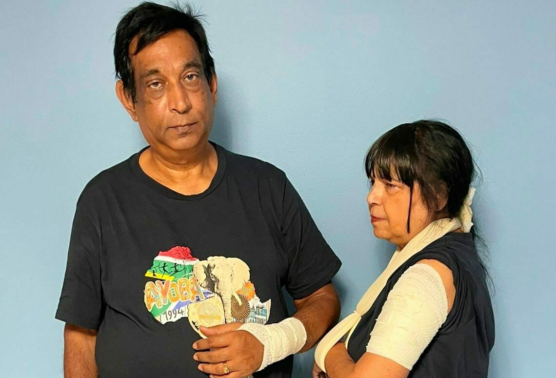 A man and woman with bandages on their hands and arms