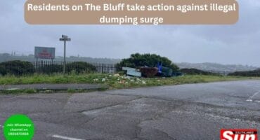 A pile of discarded furniture and rubble on the corner of an intersection
